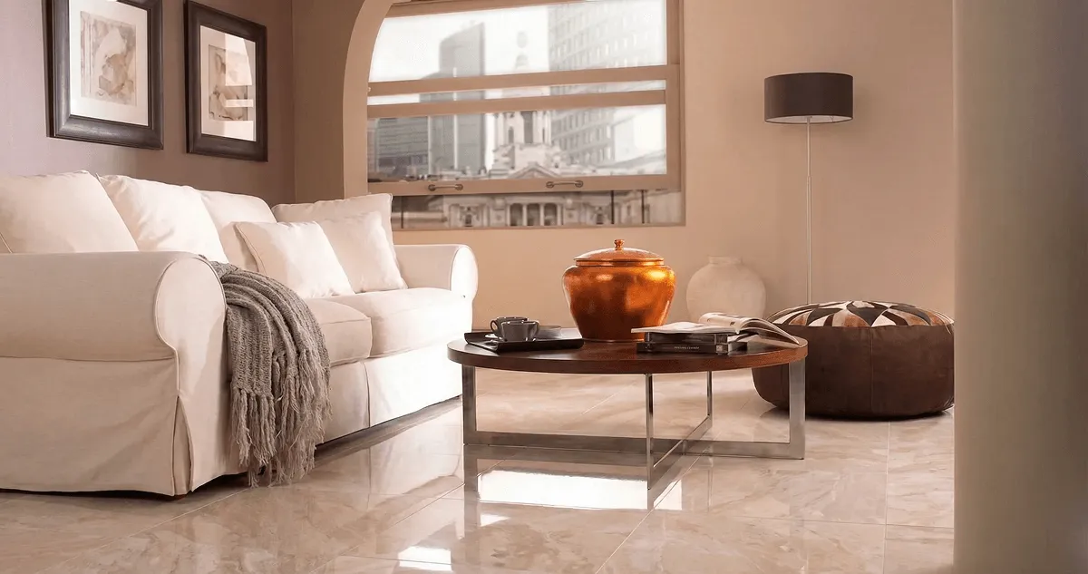Modern living room with professionally installed marble flooring, a beige sofa, coffee table in Aurora, IL