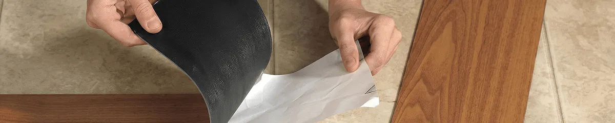 A professional installing vinyl flooring in Aurora, IL